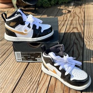 Nike Kids Black and White Sneakers with Gold Accents